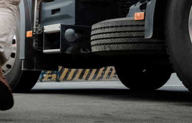 man walking toward semi truck