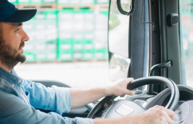 truck driver behind the wheel of semi truck