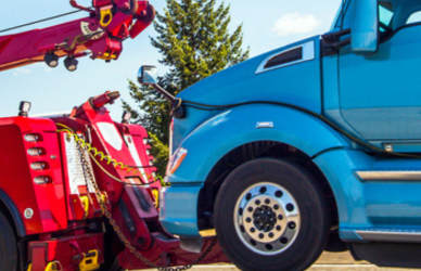 semi truck being towed