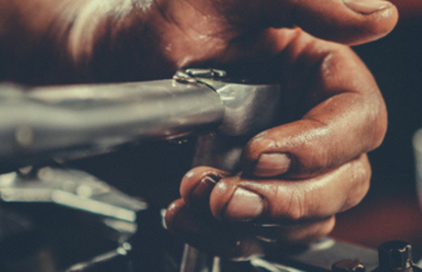 mechanic hand working on engine