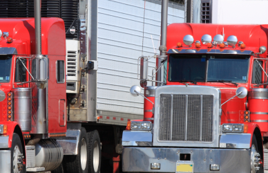 red semi trucks parked