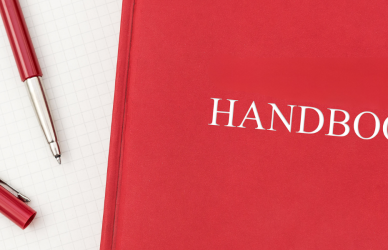 red handbook next to pen