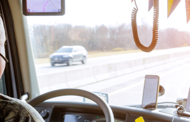 trucker in cab of semi truck