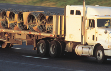 flatbed semi truck hauling coils