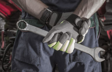 mechanic holding wrench