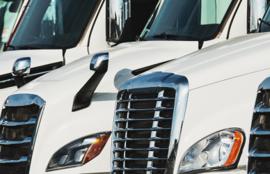 new white semi trucks parked in a line