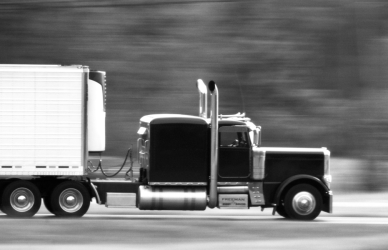 black and white picture of a semi truck