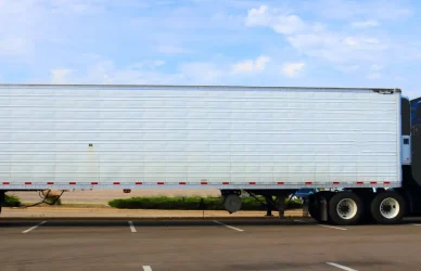 blue semi truck with white trailer