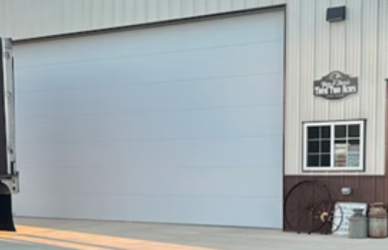 garage with semi truck parked in front - source Overdrive