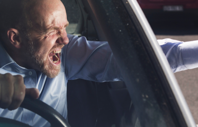 man in car with road rage