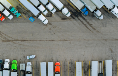 aerial view of semi trucks parked at truck stop