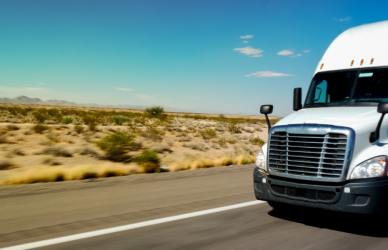 white semi truck on desert road
