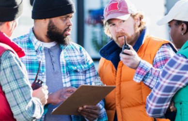 People gathered outside a truck stop