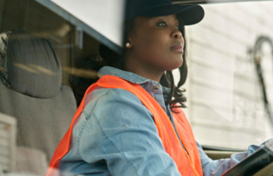 black woman driving semi truck