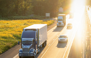 traffic on four lane highway at sunset