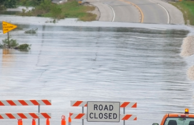 flooded road with road closed sign