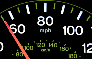 speedometer with needle pointing to 55mph