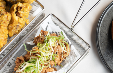 variety of plates featuring comfort foods such as fried chicken and chicken and waffles