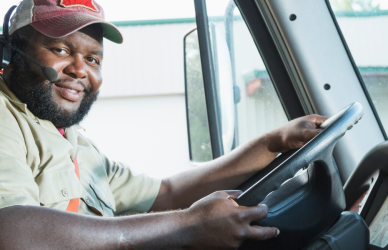 black man driving semi truck
