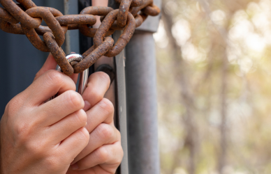 hands reaching out of chained trailer