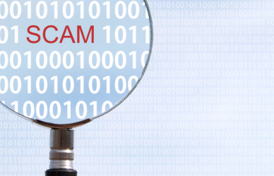 magnifying glass highlighting the word scam