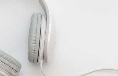 white corded headphones with grey ear pads