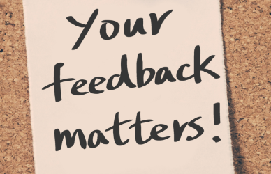 post it note with "your feedback matters" written on it in marker posted to a cork bulletin board