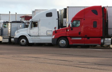 semi trucks parked at truck stop