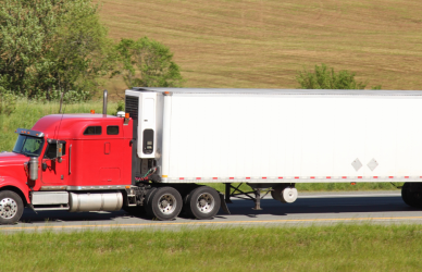 red semi truck on highway, fmcsa, grants, cdl training