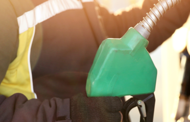 man holding diesel fuel pump, fuel cards, payment, app, relay payments, loves travel stops