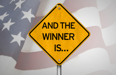 american flag and road sign that reads "and the winner is" keys to progress program, honoring veterans