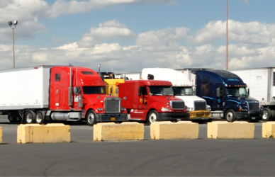 semi trucks parked in truck parking lot, expanded truck parking coming to oklahoma and maryland with TravelCenters of America