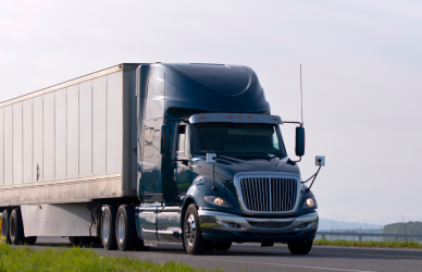 semi truck parked on side road with trees in background, cargo theft, cargo theft prevention, security, safety and security