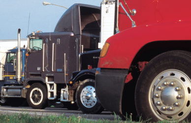 variety of semi trucks parked in a row in a truck parking lot ; TravelCenters of America has opened two new TA Express locations along I-81 in Pennsylvania, adding 287 truck parking spaces