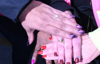 women truckers put their hands in to show solidarity and teamwork NFI She Drives