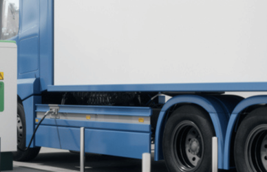 Electric semi truck charging at charging station