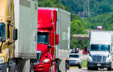 variety of semi trucks on busy interstate highway usa