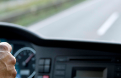 inside of semi truck cab driving down road