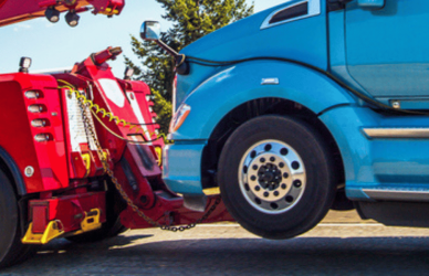 semi truck being towed