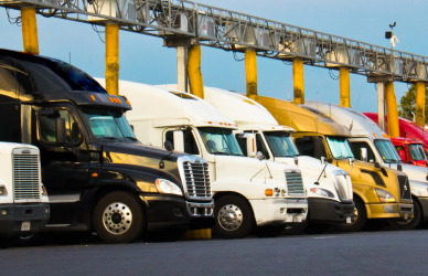 semi trucks parked at truck stop