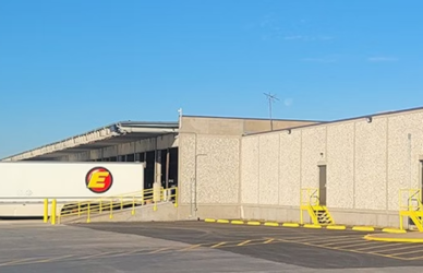 estes express terminal with estes express trailer backed up to the doc