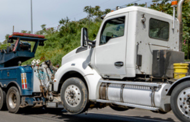 semi truck being towed