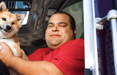 trucker in semi cab with dog