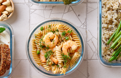 various meals spread out on a countertop in resealable containers