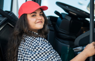Woman getting into cab of semi truck