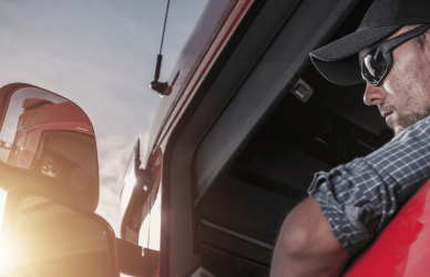 trucker in truck with arm out window