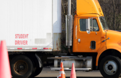 orange student driver semi truck