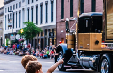 semi truck parade with children