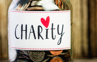 jar containing coins with a charity label on it
