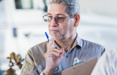 Instructor with students with semi truck in background
